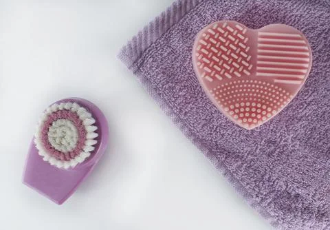 Flatlay bath accessories. Top view face cleansing brush, sponge, towel. 스톡 사진