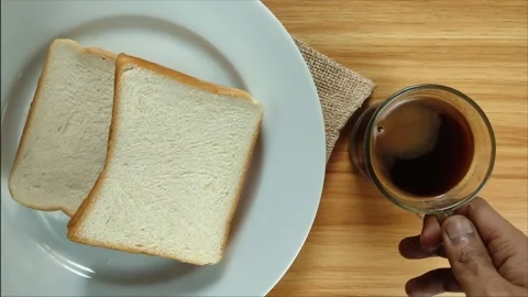 Flatlay of Black Coffee and White Bread – Cozy Morning Simple Breakfast Stock Footage 318657691