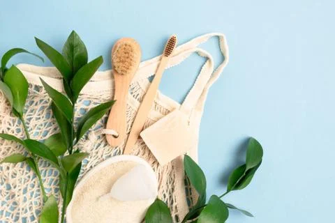 Flatlay of green leaves, string bag and zero waste accessories Stock Photos