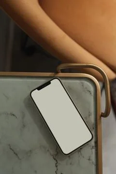 Flatlay mobile phone on marble table. Aesthetic elegant blog, online shopping Stock Photos