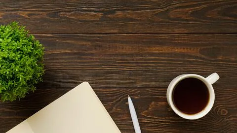Flatlay with office items and place for text. Layout on a wooden background. Stock Photos