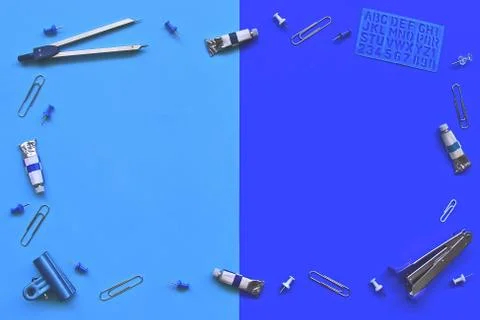 Flatlay of office items on a blue background. Stock Photos