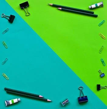 Flatlay of office items on a green background. Stock Photos