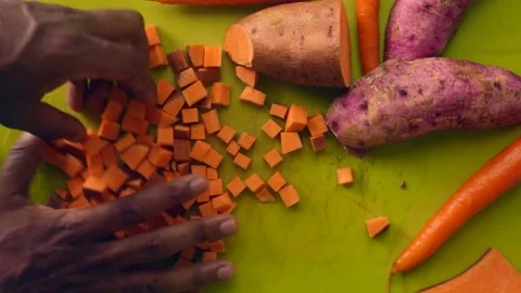 Flatlay person hands preparing vegetables on chopping board - 1 5 se Stock Footage 130288900