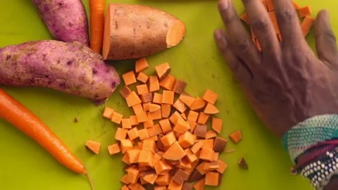 Flatlay person hands preparing vegetables on chopping board - 1 5s Stock Footage 130288952