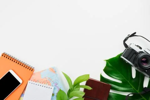 Flatlay with retro film camera, map, notebooks, smartphone with black copyspa Stock Photos