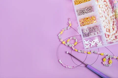 Flatlay of seed beads with tools for making jewelry Stock Photos