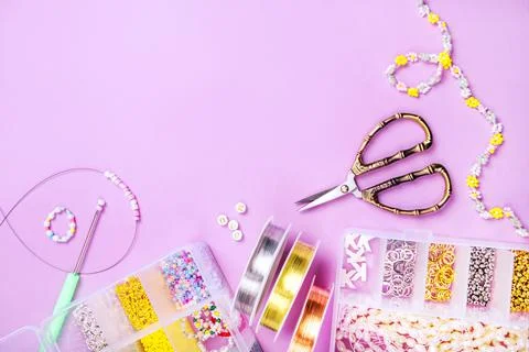 Flatlay of seed beads with tools for making jewelry Stock Photos