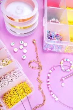 Flatlay of seed beads with tools for making jewelry Stock Photos