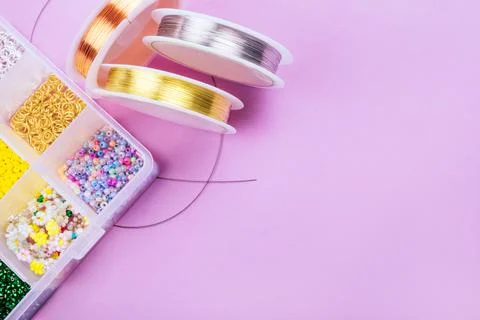 Flatlay of seed beads with tools for making jewelry Stock Photos