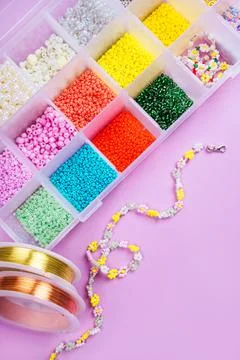 Flatlay of seed beads with tools for making jewelry Stock Photos
