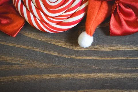 Flatlay of some Red typical Christmas decorations, on a dark wooden background. Stock Photos