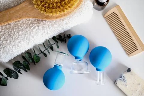 Flatlay spa items. massage jars and a brush. Body and face care. Massage cups Stock Photos