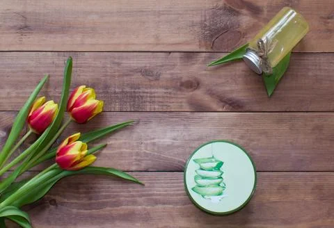 Flatlay Spring Easter bouquet of tulip flowers with cosmetic product, gel Stock Photos