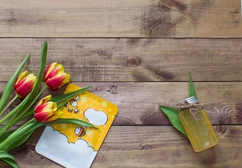 Flatlay Spring Easter bouquet of tulip flowers with cosmetic products, mask Stock Photos
