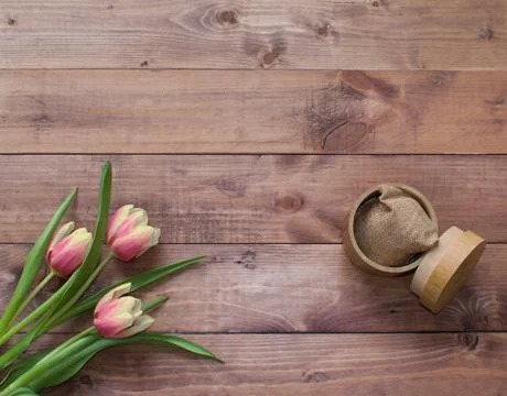 Flatlay Spring Easter bouquet of tulip flowers with wood  box and linen sack Stock Photos
