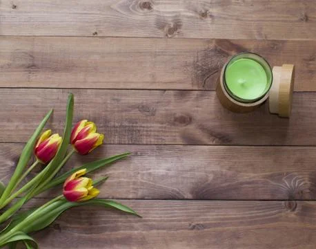 Flatlay Spring Easter bouquet of tulip flowers with wood box and candle Stock Photos