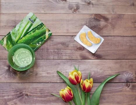 Flatlay Spring Easter bouquet of tulip flower with cosmetic products, patches Stock Photos