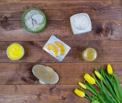 Flatlay Spring Easter bouquet of yellow tulip flowers with cosmetic products  Stock Photos