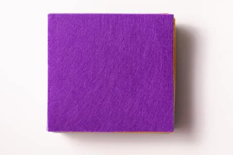 Flatlay a stack of felt pieces with a purple top on a white background Stock Photos