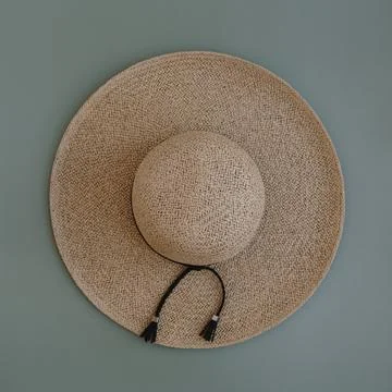Flatlay straw hat on pastel blue background. Flat lay, top view minimalist fa Stock Photos