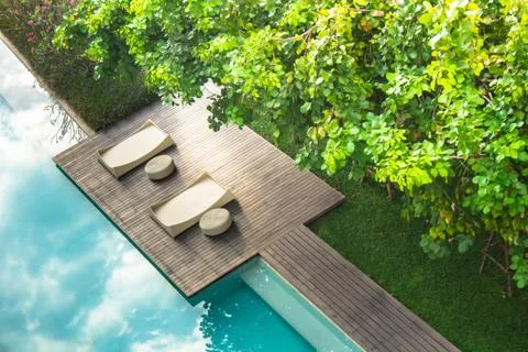 Flatlay sunbathing terrace pool side. Stock Photos