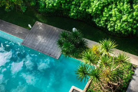 Flatlay sunbathing terrace pool side. Stock Photos