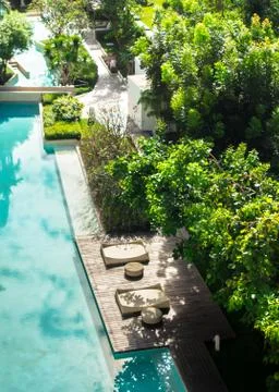 Flatlay sunbathing terrace pool side. Stock Photos