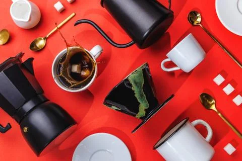 Flatlay of various coffee accessories knolled together on red, concept of alt Stock Photos