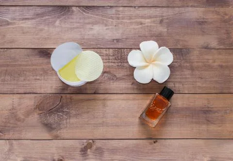 Flatlay view spa cosmetics products for face and body on wooden background Stock Photos
