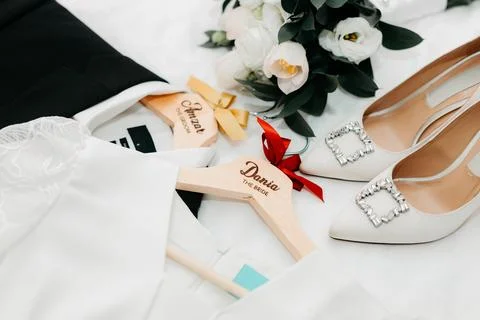 A flatlay of wedding essentials including personalized hangers Stock-Fotos
