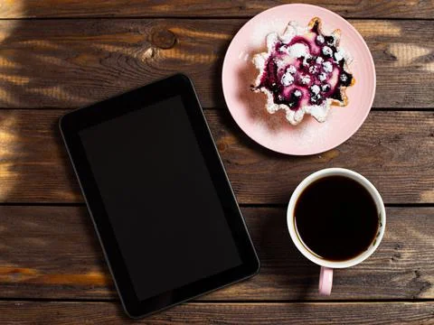 Flatley coffee break layout. Digital tablet gadget, black coffee in a cup and Stock Photos