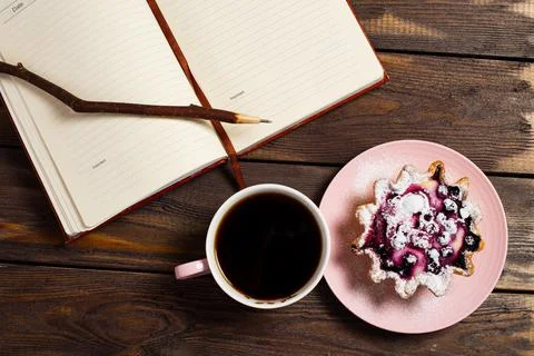 Flatley layout. Open notebook, vintage twig pen, black coffee in a cup and ca Stock Photos