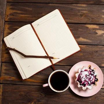Flatley layout. Open notebook, vintage twig pen, black coffee in a cup and ca Stock Photos
