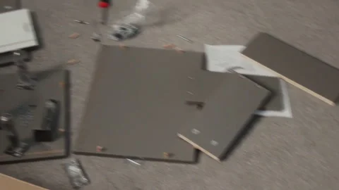 Flatpack Drawer Parts and Tools Scattered on Floor during Home Assembly Stock Footage 330522546