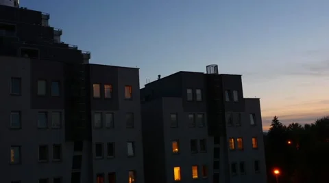 Flats after the sunset. The lights in the flats are turn on. Timelaps. Stock Footage 61093560