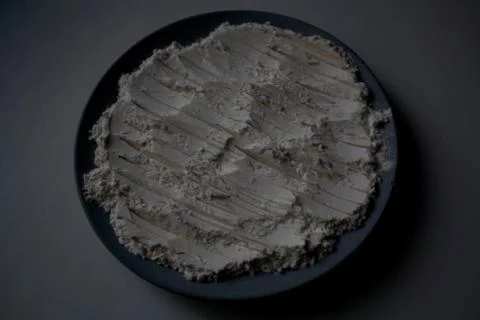 Flatten flour heap with pattern on plate Stock Photos