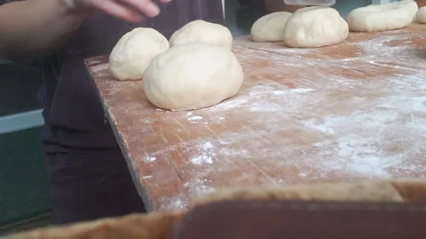 Flattening dough balls for baking Stock Footage 255449169