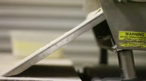 Flattening dough with machine pan left 2 Stock Footage 9454839