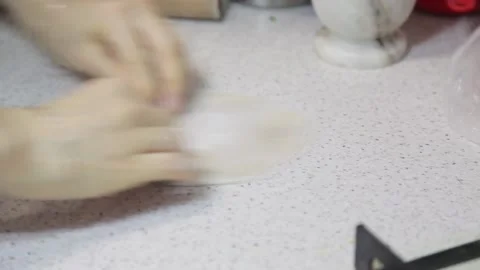 Flattening dough with rolling pin Stock Footage 145609596