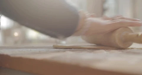 FlatteningDoughWithRollingPin Stock Footage 88838709