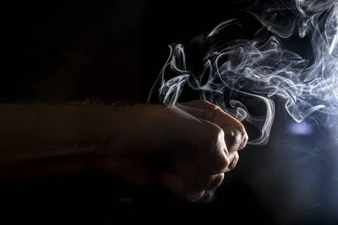  Flavored incense smoke burning. dramatic black background. Salvador Bahia... Stock Photos