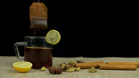 Flavored tea bag dipped in hot water to make a cup of aromatic green tea Stock Footage 154679723