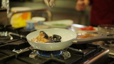 Flavoring seafood in a pan Stock Footage 88439558