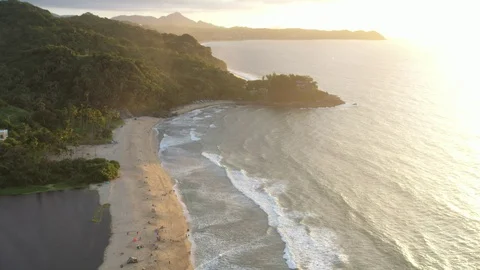 A flawless combination by the sunset through sand hit by the waves Video stock 122626377