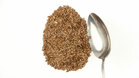 Flax seeds arranged in egg shape, replacing eggs in vegan or vegeterian recipe Video stock 138890873