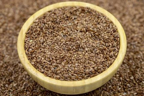 Flax seeds background or texture. Flaxseed or linseed in wooden bowl. Cereals Stock-Fotos