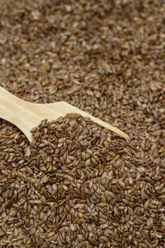 Flax seeds background or texture. Flaxseed or linseed in wooden spoon. cereal Stock Photos