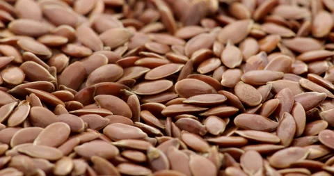 Flax seeds background. Seamless loop. Stock Footage 251166411