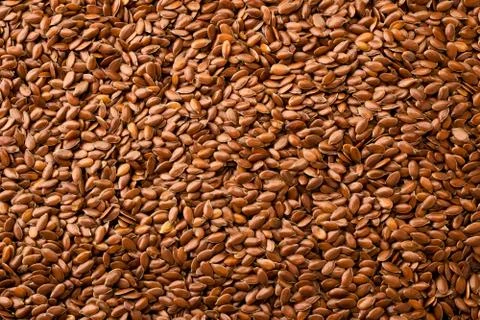 Flax seeds background. The view of the top. Stock Photos